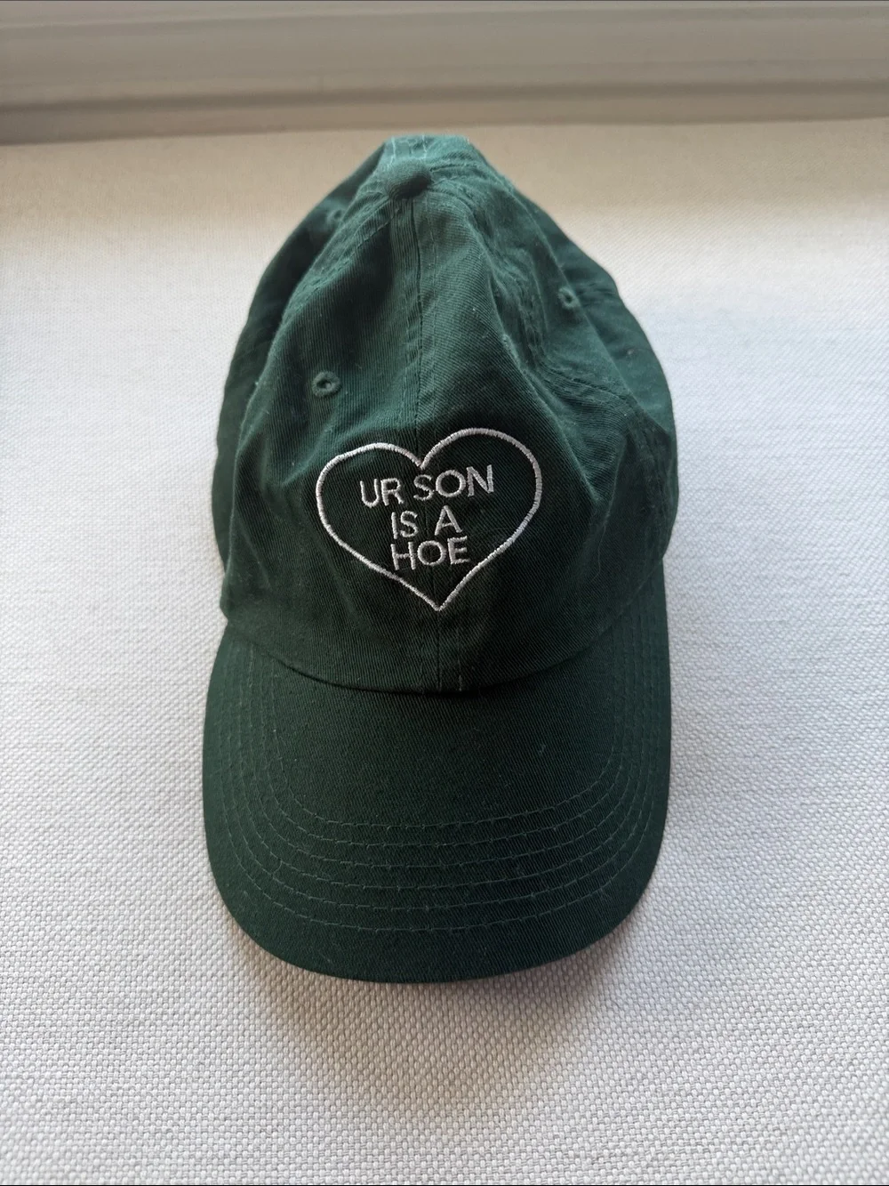 Dark Green Embroidered Heart Cap - 'UR SON IS A H*'
